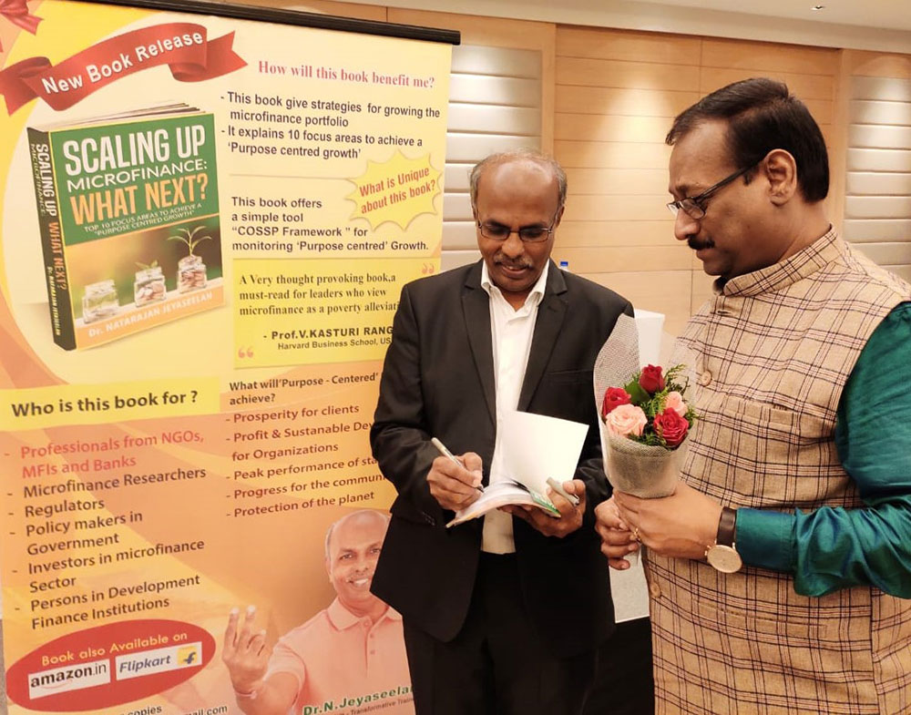 <p>Dr.N.Jeyaseelan, Author of the book-Scaling up Microfinance: What next? is seen signing the book at the Book launch at Chennai.</p>
